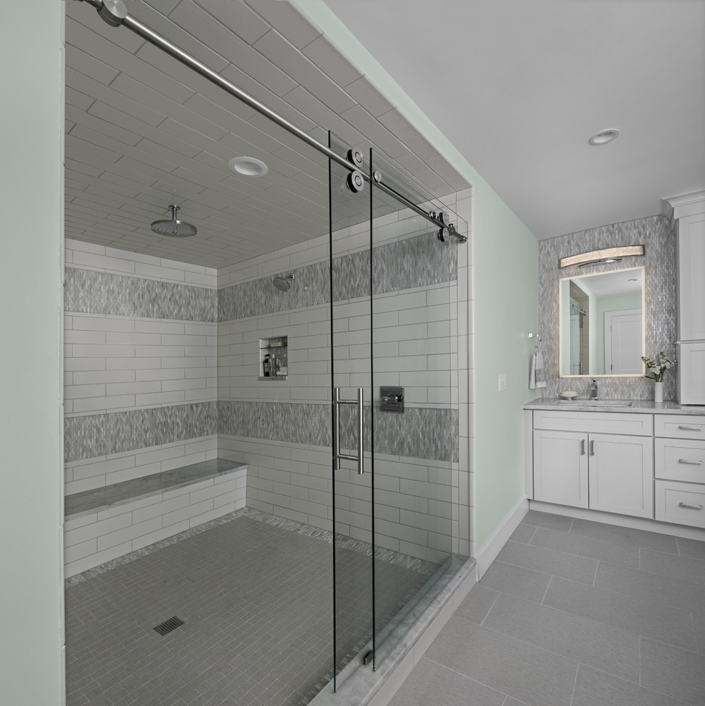 Design ideas for a classic ensuite bathroom in Other with shaker cabinets, white cabinets, a freestanding bath, a double shower, green tiles, glass tiles, green walls, marble flooring, a submerged sink, marble worktops, grey floors, a sliding door and grey worktops.