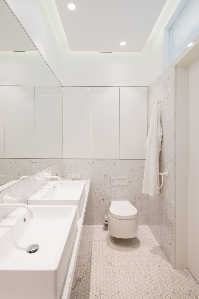 Photo of a contemporary bathroom in Moscow with a wall mounted toilet.