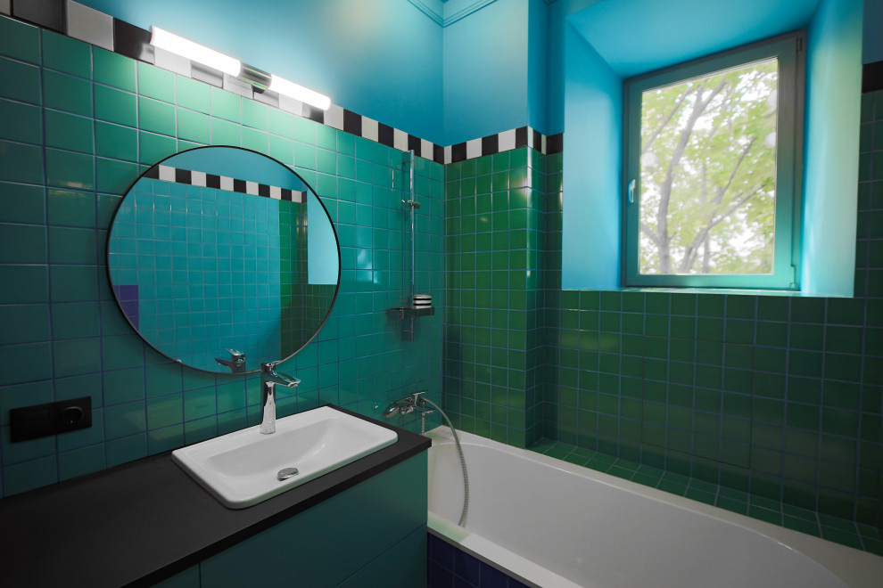 Small 1960s multicolored tile and ceramic tile single-sink bathroom photo in Moscow with a wall-mount toilet, an integrated sink, black countertops and a built-in vanity