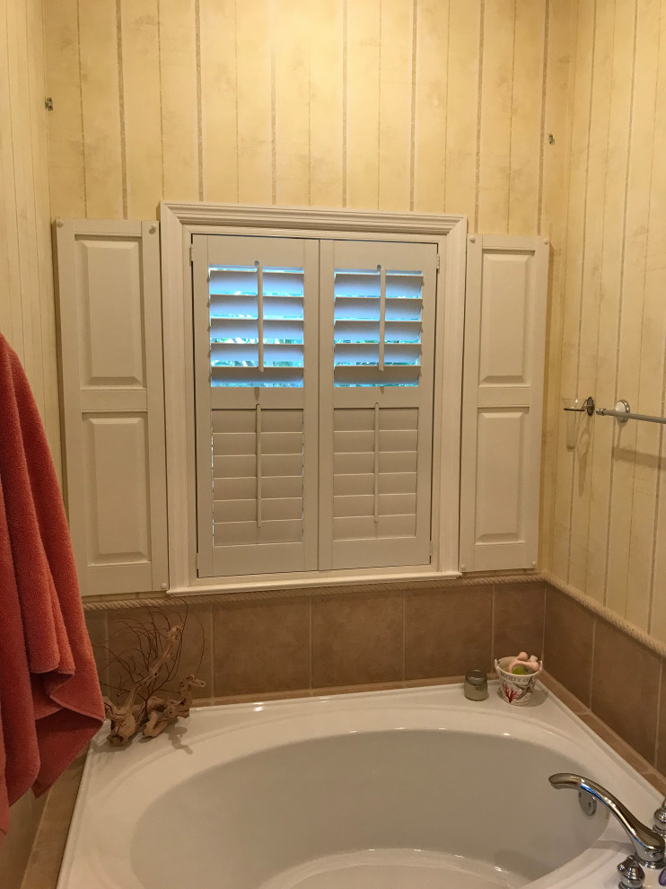 Large minimalist master gray tile and porcelain tile medium tone wood floor and brown floor double shower photo in Jacksonville with shaker cabinets, white cabinets and a hinged shower door