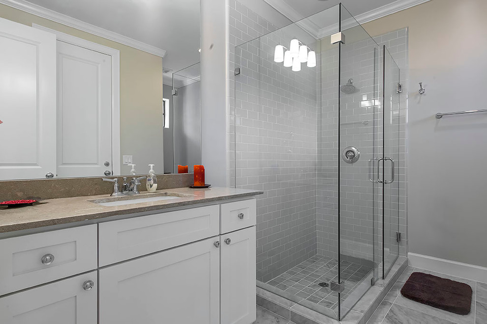 Photo of a medium sized modern ensuite bathroom in Houston with beige walls, ceramic flooring and marble worktops.