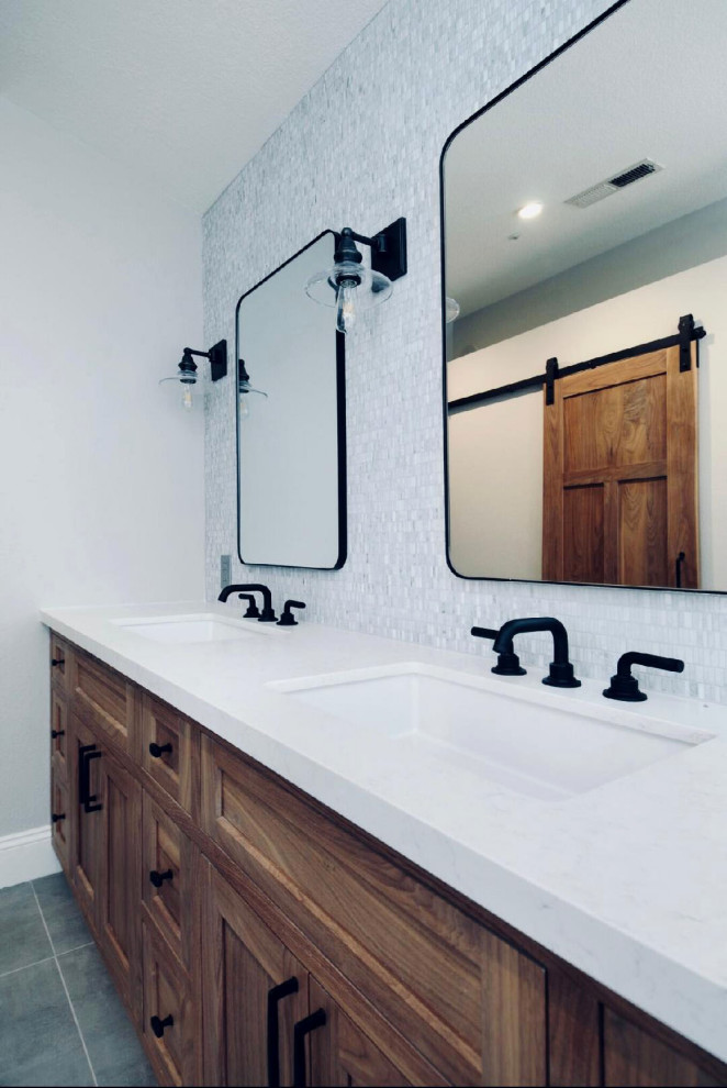 Large urban master gray tile and cement tile cement tile floor and gray floor bathroom photo in Los Angeles with quartz countertops, white countertops, recessed-panel cabinets, medium tone wood cabinets, a two-piece toilet, gray walls, an undermount sink and a hinged shower door