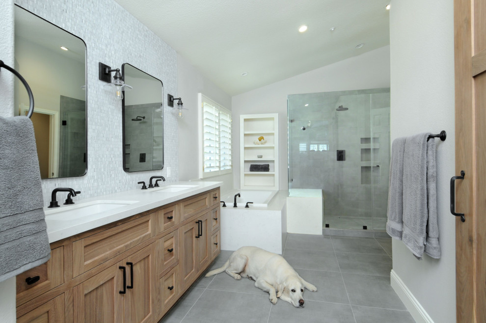 Inspiration for a large industrial master gray tile and cement tile cement tile floor and gray floor bathroom remodel in Los Angeles with quartz countertops, white countertops, recessed-panel cabinets, medium tone wood cabinets, a two-piece toilet, gray walls, an undermount sink and a hinged shower door