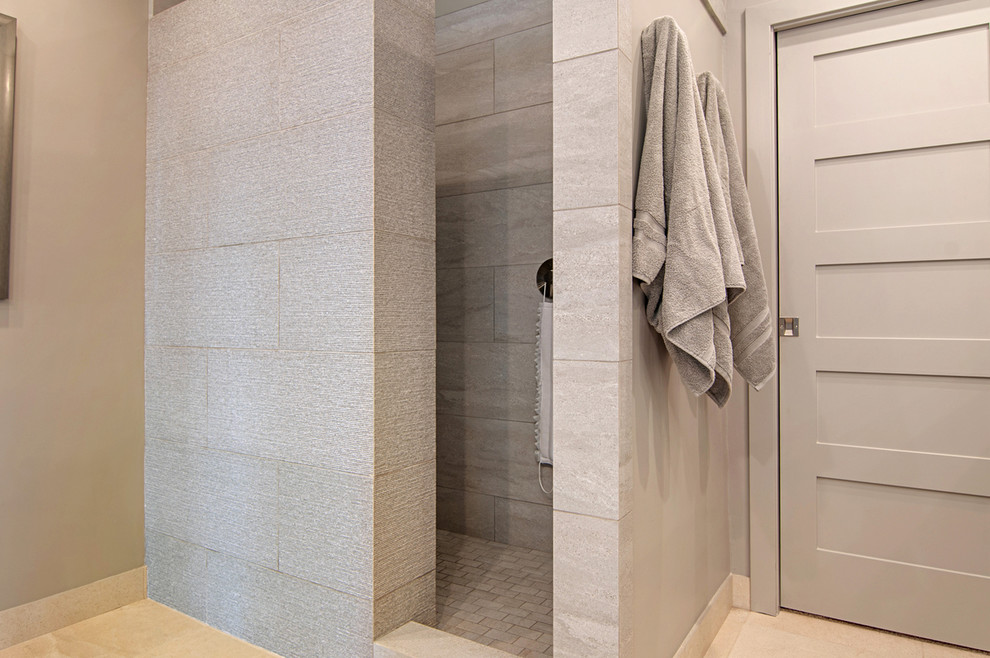 Bathroom - mid-sized contemporary master beige tile and ceramic tile bathroom idea in San Diego with recessed-panel cabinets, gray cabinets, a one-piece toilet, beige walls, an undermount sink and quartz countertops