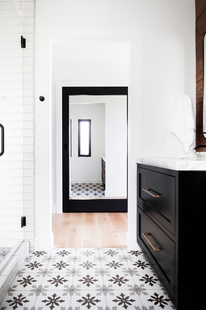 Alcove shower - mid-sized 1960s master white tile and subway tile cement tile floor and multicolored floor alcove shower idea in San Diego with beaded inset cabinets, black cabinets, white walls, an undermount sink, marble countertops, a hinged shower door and white countertops