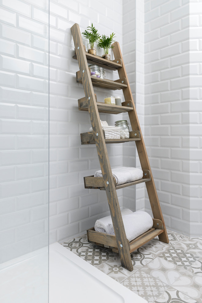 Small urban kids' white tile and ceramic tile ceramic tile doorless shower photo in Other with a one-piece toilet, beige walls and a pedestal sink