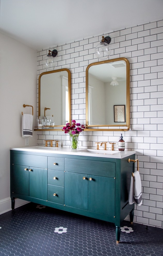 Transitional white tile and subway tile ceramic tile and black floor bathroom photo in Portland with green cabinets, white walls, an undermount sink, solid surface countertops and furniture-like cabinets
