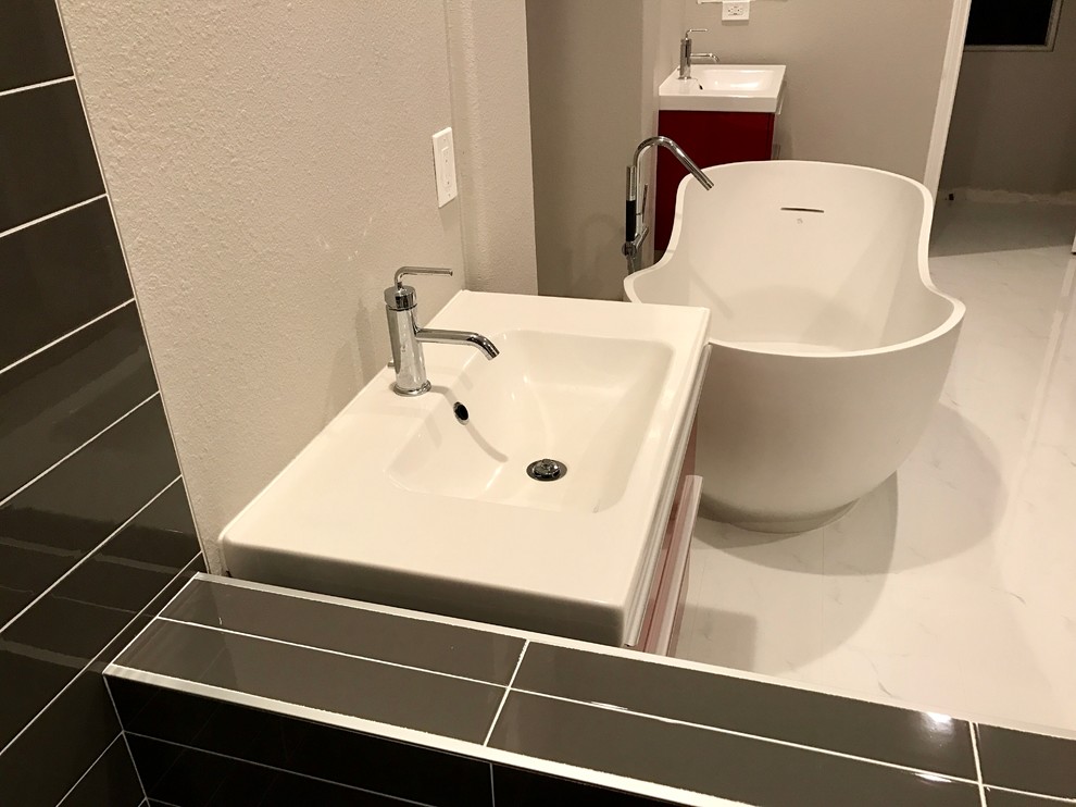 Example of a mid-sized trendy master gray tile and porcelain tile marble floor and white floor bathroom design in Orange County with flat-panel cabinets, red cabinets, white walls, an integrated sink and solid surface countertops