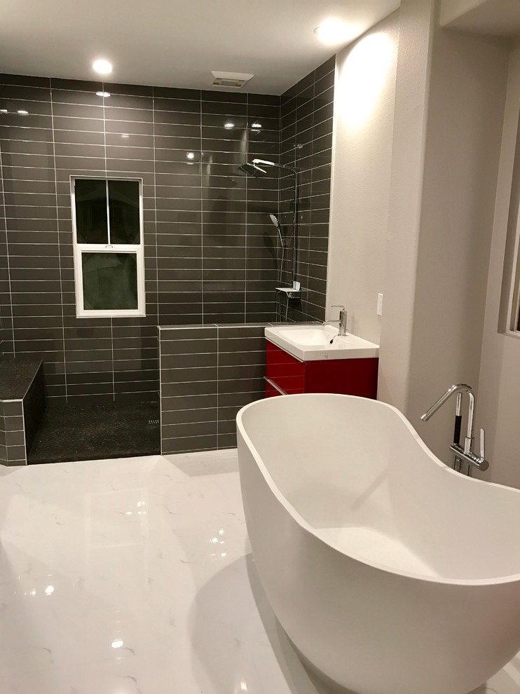 Mid-sized trendy master porcelain tile and gray tile marble floor and white floor bathroom photo in Orange County with flat-panel cabinets, red cabinets, white walls, an integrated sink and solid surface countertops