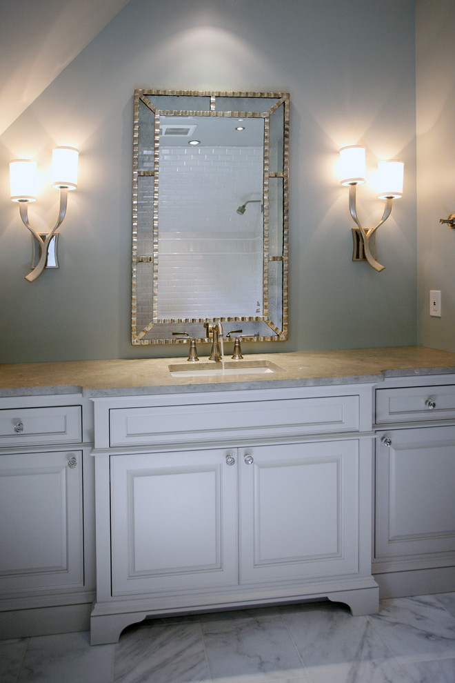 This is an example of a classic bathroom in Atlanta with limestone worktops and marble flooring.