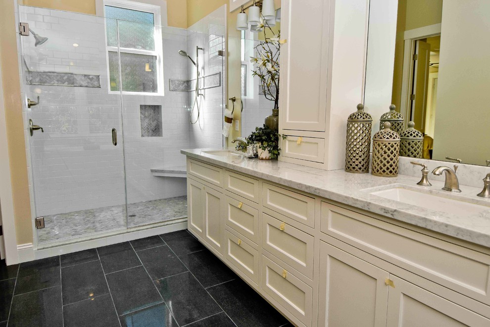 Large classic ensuite bathroom in San Francisco with white cabinets, a submerged sink, recessed-panel cabinets, a freestanding bath, an alcove shower, a two-piece toilet, grey tiles, metro tiles, beige walls, marble flooring and marble worktops.
