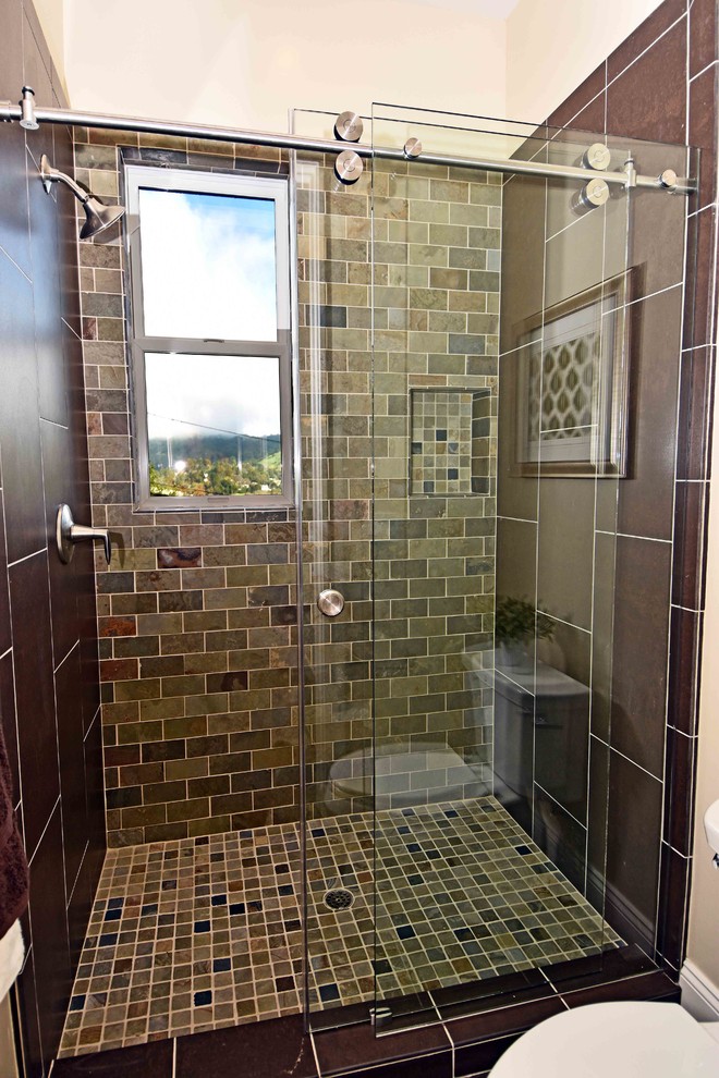 Example of a mid-sized transitional 3/4 brown tile, multicolored tile and subway tile ceramic tile alcove shower design in San Francisco with a two-piece toilet, beige walls, recessed-panel cabinets, yellow cabinets, an undermount sink and quartz countertops
