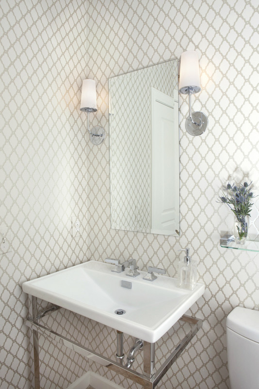 This is an example of a medium sized traditional bathroom in Philadelphia with a console sink, a two-piece toilet, beige tiles, white walls and travertine flooring.