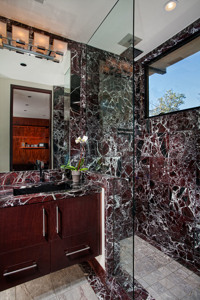 Design ideas for a contemporary bathroom in Orange County with flat-panel cabinets, dark wood cabinets, marble worktops, red tiles, marble tiles and feature lighting.