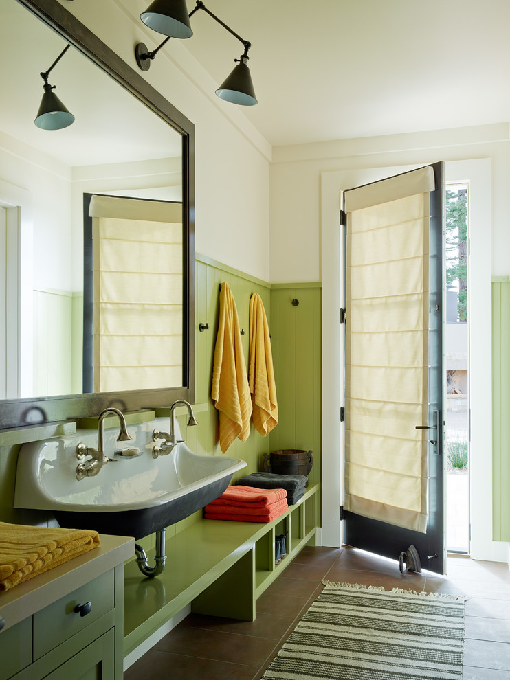 Photo of a farmhouse bathroom in San Francisco with a trough sink, flat-panel cabinets, green cabinets and white walls.