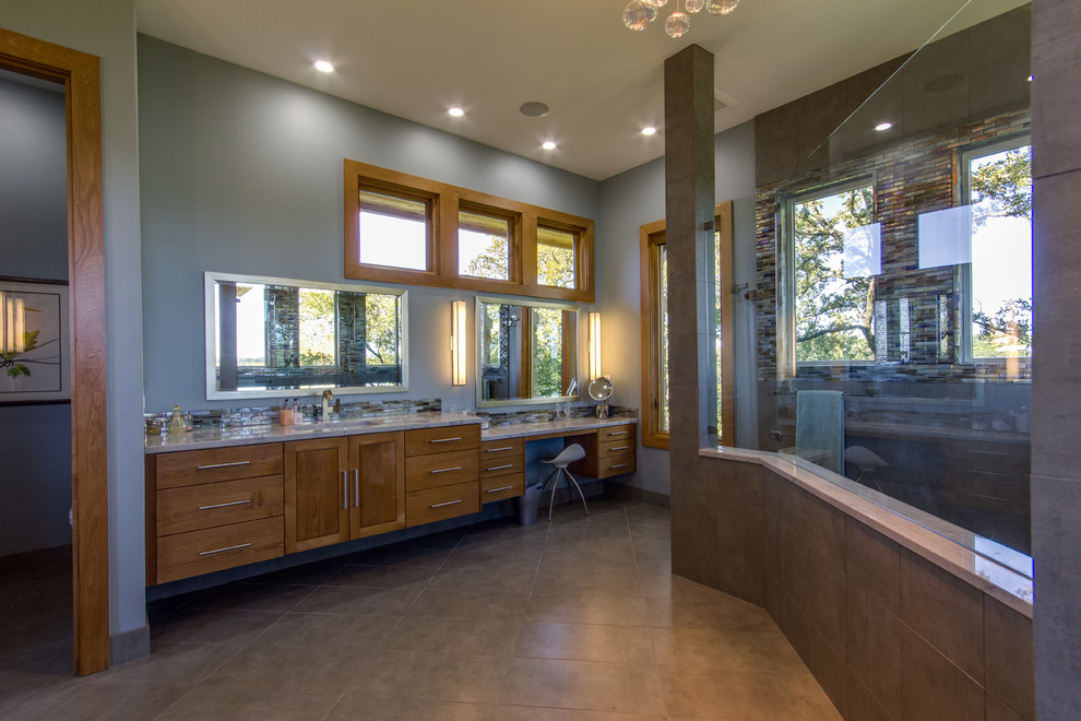 Example of a large arts and crafts master multicolored tile and glass tile ceramic tile and gray floor bathroom design in Austin with an undermount sink, flat-panel cabinets, light wood cabinets, marble countertops, blue walls and gray countertops