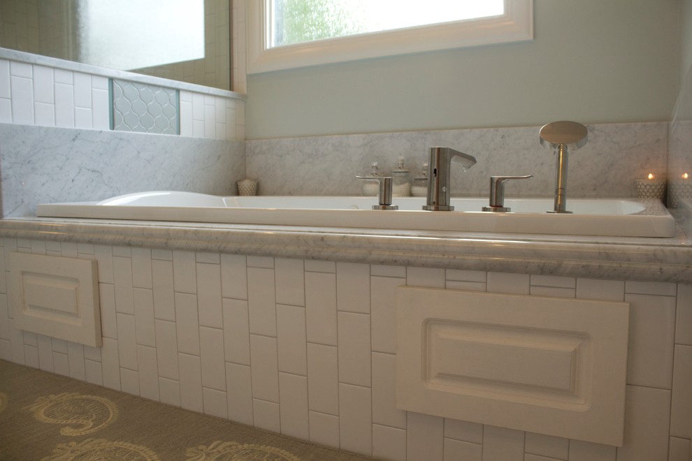 Example of a large classic master white tile and ceramic tile ceramic tile bathroom design in Jackson with an undermount sink, raised-panel cabinets, white cabinets, marble countertops, a two-piece toilet and gray walls