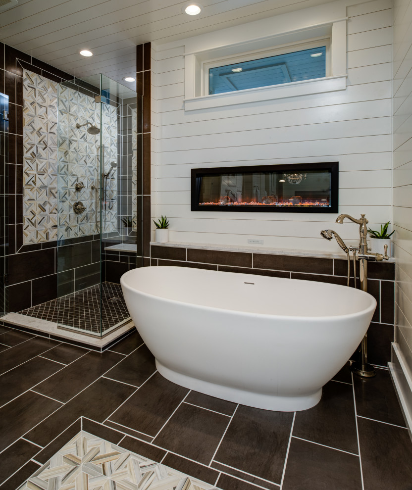 This is an example of a large nautical ensuite bathroom in Other with white cabinets, a freestanding bath, a corner shower, a one-piece toilet, white tiles, metro tiles, white walls, porcelain flooring, a submerged sink, granite worktops, multi-coloured floors, a hinged door and white worktops.