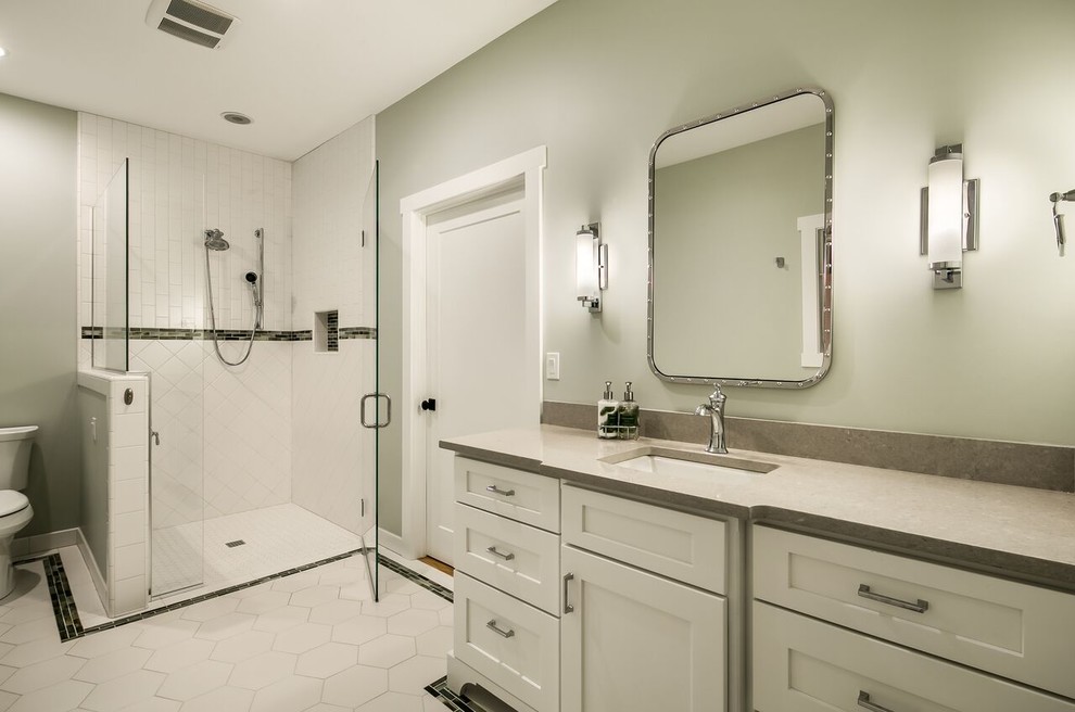Walk-in shower - mid-sized craftsman kids' black and white tile and ceramic tile ceramic tile and white floor walk-in shower idea in Other with recessed-panel cabinets, white cabinets, a two-piece toilet, green walls, an undermount sink, a hinged shower door and quartz countertops