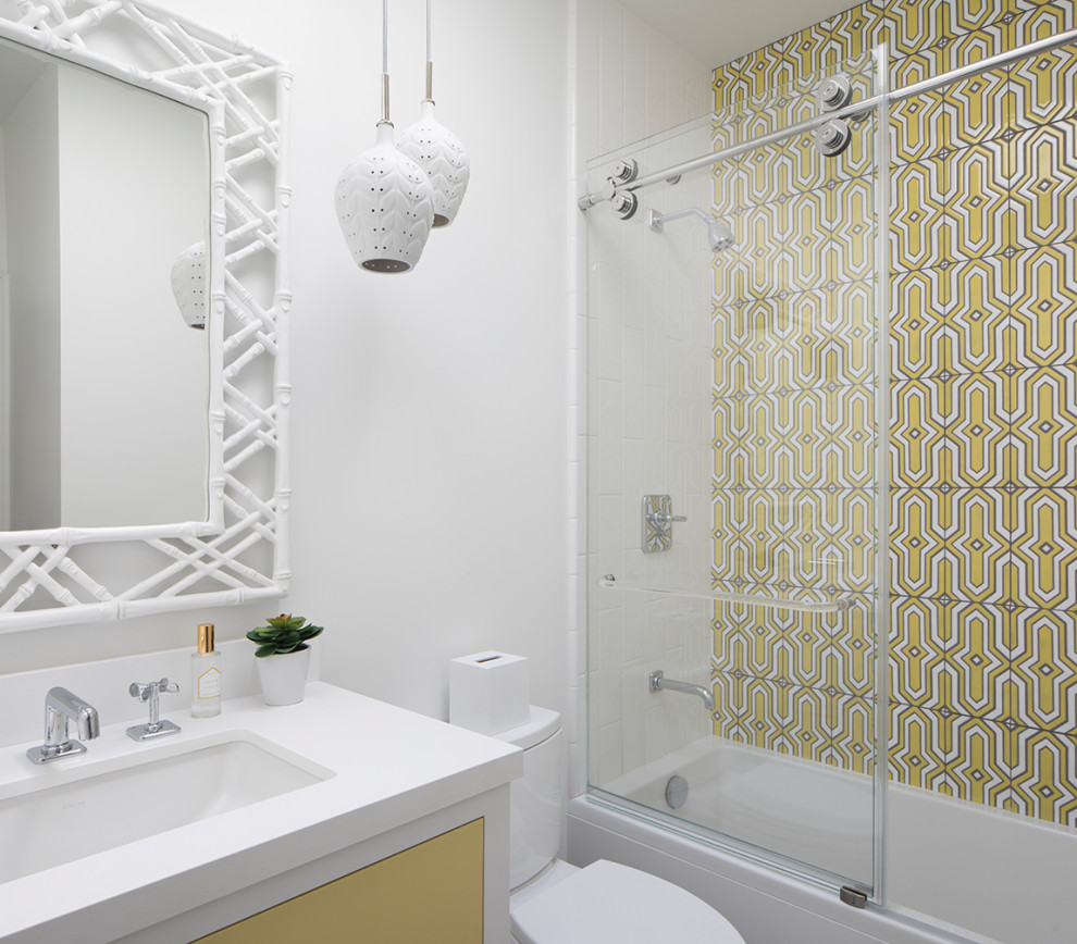 This is an example of a medium sized classic family bathroom in San Francisco with flat-panel cabinets, an alcove bath, a shower/bath combination, ceramic tiles, white walls, a submerged sink, a sliding door, a single sink and a two-piece toilet.