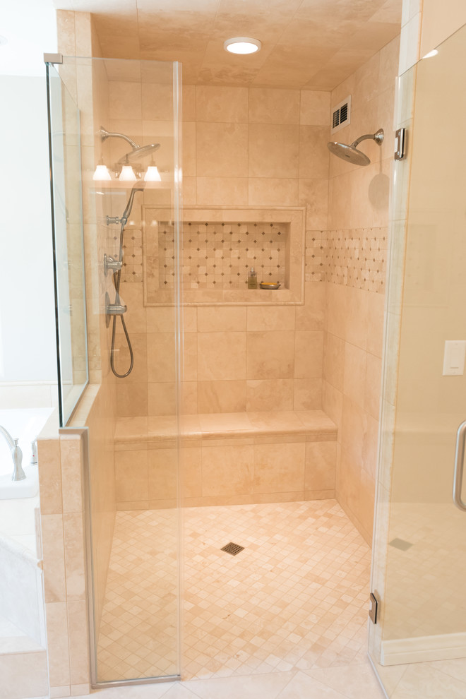 This is an example of a large traditional ensuite bathroom in Milwaukee with white cabinets, a built-in bath, a built-in shower, beige tiles, travertine tiles, beige walls, travertine flooring, beige floors and a hinged door.