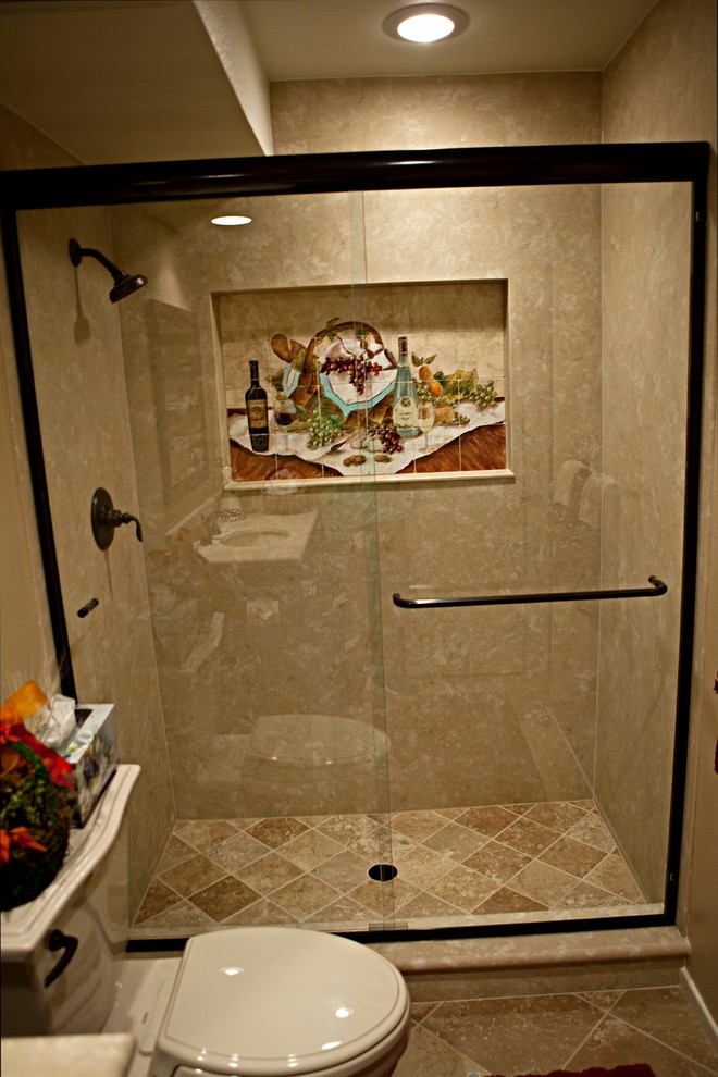 Alcove shower - small traditional 3/4 beige tile and porcelain tile porcelain tile alcove shower idea in Orange County with an undermount sink, raised-panel cabinets, dark wood cabinets, solid surface countertops, a two-piece toilet and beige walls