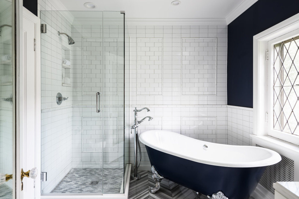 Mid-sized elegant kids' white tile and ceramic tile marble floor and gray floor bathroom photo in St Louis with recessed-panel cabinets, white cabinets, a one-piece toilet, blue walls, an undermount sink, quartz countertops, a hinged shower door and white countertops
