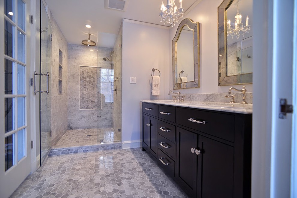 Example of a mid-sized classic master white tile and stone slab mosaic tile floor and gray floor double shower design in Chicago with an integrated sink, furniture-like cabinets, dark wood cabinets, marble countertops, a one-piece toilet, white walls and a hinged shower door