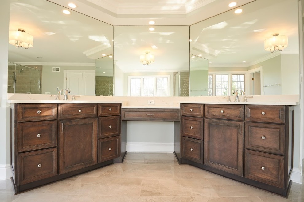 Bathroom - large traditional master beige tile and ceramic tile travertine floor and beige floor bathroom idea in Chicago with beaded inset cabinets, dark wood cabinets, a one-piece toilet, gray walls, an undermount sink, marble countertops, a hinged shower door and white countertops
