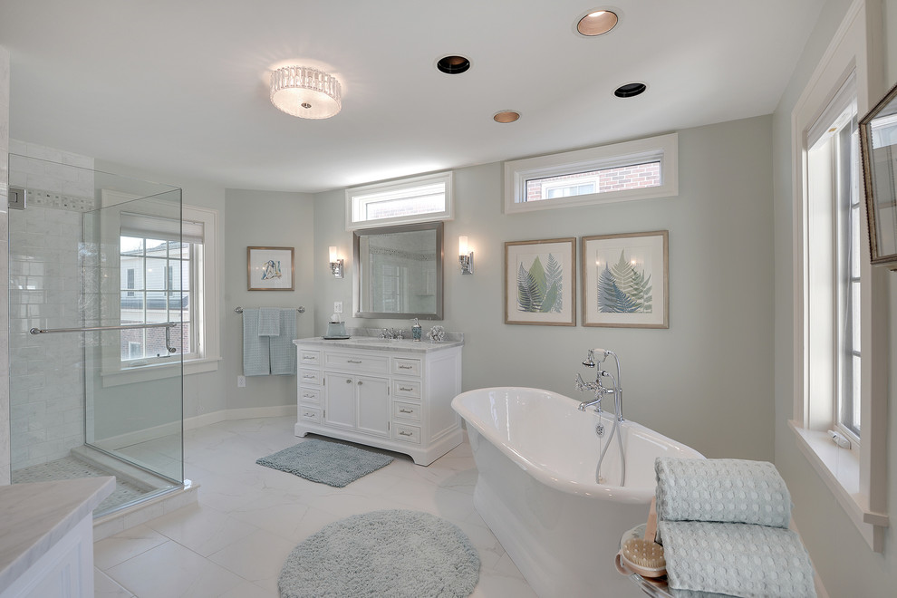 Bathroom - large traditional master white tile and porcelain tile porcelain tile and white floor bathroom idea in Minneapolis with an undermount sink, furniture-like cabinets, white cabinets, marble countertops, green walls and a hinged shower door
