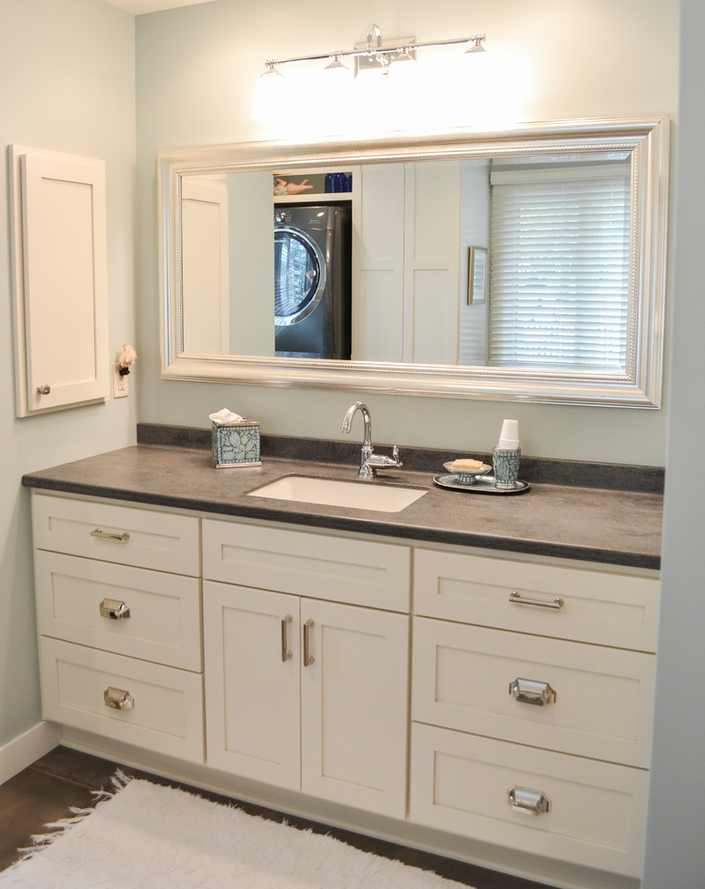 This is an example of a traditional family bathroom in Other with flat-panel cabinets, white cabinets, ceramic flooring, a submerged sink, solid surface worktops, grey floors and grey worktops.