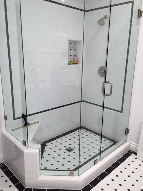 This is an example of a classic bathroom in Orange County with flat-panel cabinets, white cabinets, tiled worktops and white tiles.