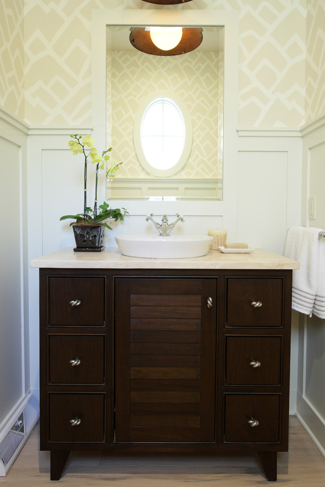 Beach style 3/4 light wood floor bathroom photo in Grand Rapids with a drop-in sink, flat-panel cabinets, dark wood cabinets, quartzite countertops and yellow walls