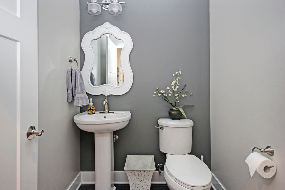 Beach style bathroom photo in Grand Rapids with a pedestal sink and gray walls