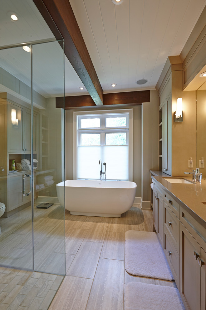 Example of a classic bathroom design in Toronto with an undermount sink, recessed-panel cabinets and beige cabinets