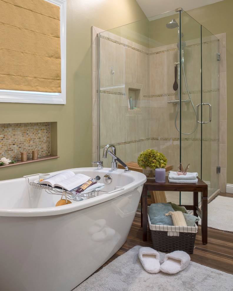 Freestanding bathtub - large modern master brown tile and porcelain tile porcelain tile freestanding bathtub idea in St Louis with a vessel sink, shaker cabinets, brown cabinets, onyx countertops, a one-piece toilet and green walls