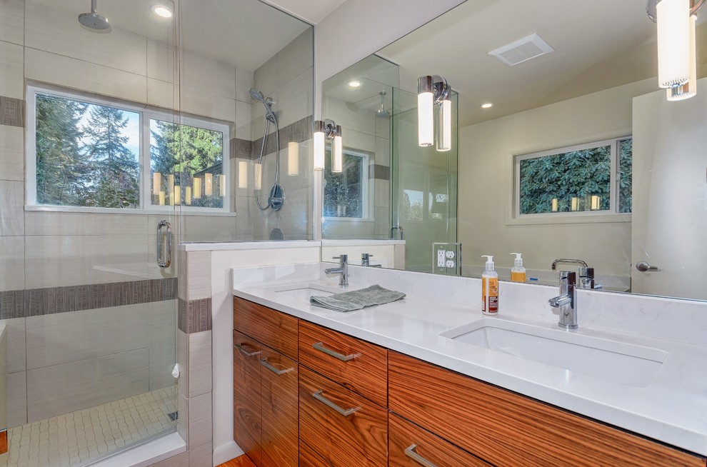 Example of a mid-sized trendy master beige tile and ceramic tile medium tone wood floor double shower design in Portland with an undermount sink, flat-panel cabinets, dark wood cabinets, quartzite countertops, an undermount tub, a two-piece toilet and beige walls