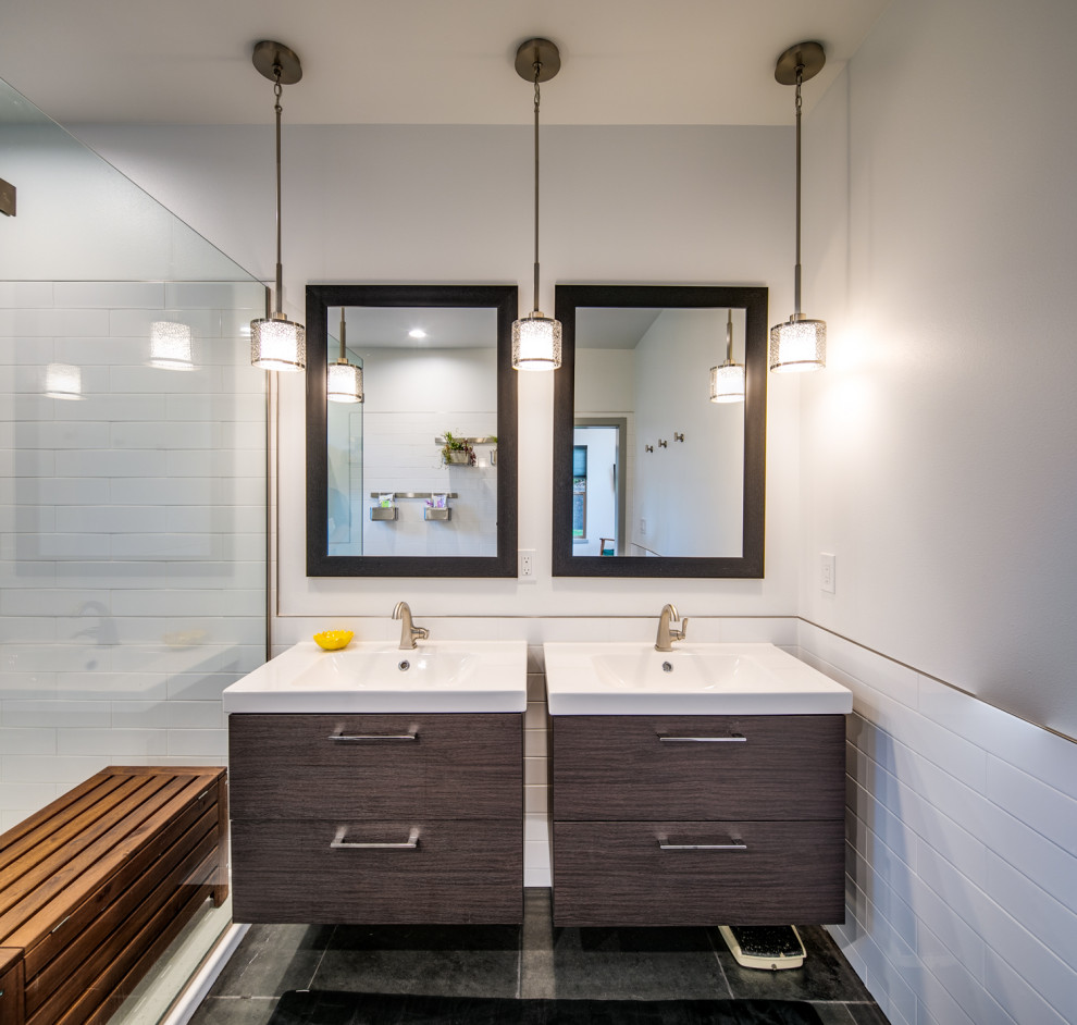 Inspiration for a mid-sized contemporary master white tile and subway tile slate floor, black floor and double-sink shower bench remodel in Seattle with flat-panel cabinets, gray walls, an integrated sink, white countertops, brown cabinets and a floating vanity