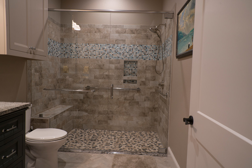 Photo of a rural family bathroom in Dallas with recessed-panel cabinets, grey cabinets, a built-in shower, porcelain tiles and a hinged door.