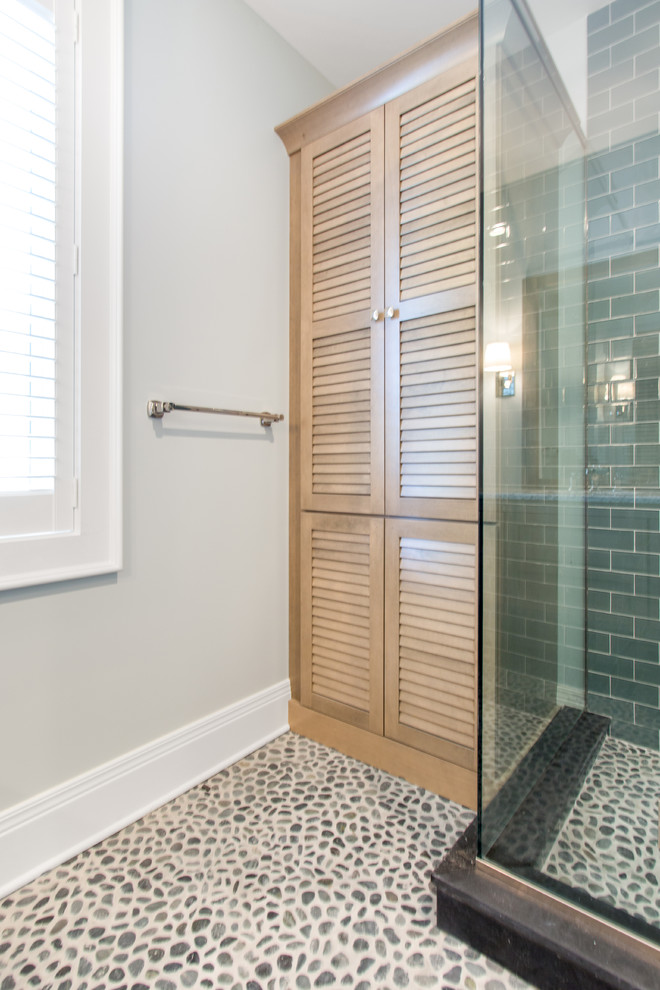 Example of a mid-sized transitional gray tile and subway tile pebble tile floor alcove shower design in Milwaukee with louvered cabinets, beige cabinets, a one-piece toilet, gray walls, an undermount sink and granite countertops