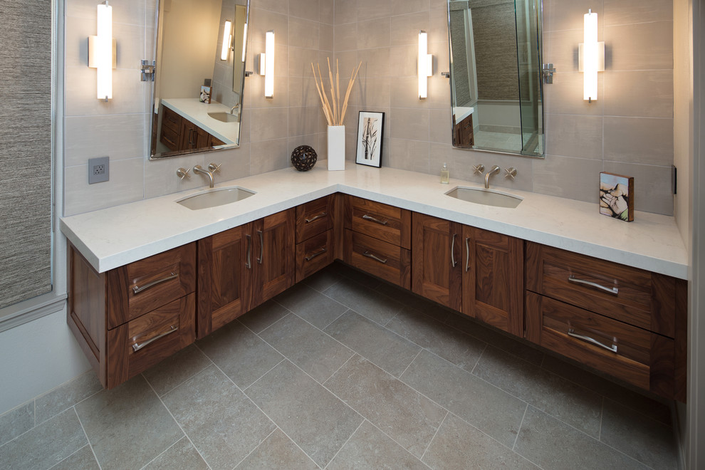 Bathroom - mid-sized contemporary master porcelain tile and gray floor bathroom idea in San Luis Obispo with recessed-panel cabinets, dark wood cabinets, beige walls, an undermount sink and quartzite countertops