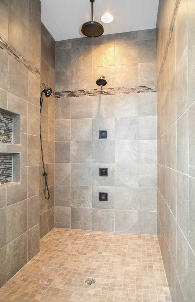 Photo of a traditional ensuite bathroom in Minneapolis with a walk-in shower, grey tiles, ceramic tiles and ceramic flooring.