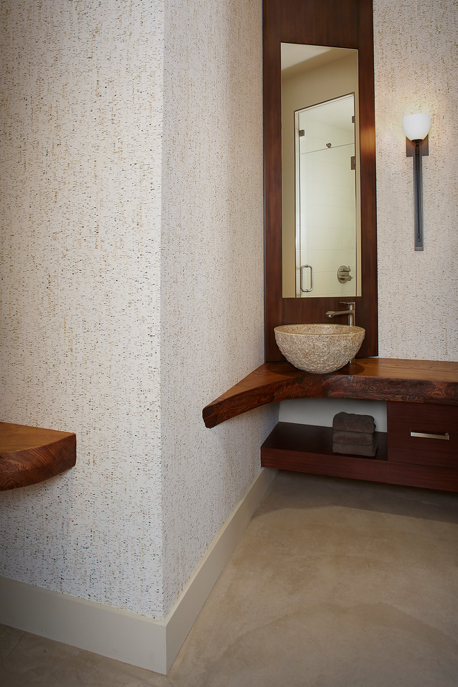 Photo of a contemporary shower room bathroom in Sacramento with open cabinets, dark wood cabinets, a corner shower, beige walls, concrete flooring, a vessel sink, wooden worktops, grey floors and a hinged door.