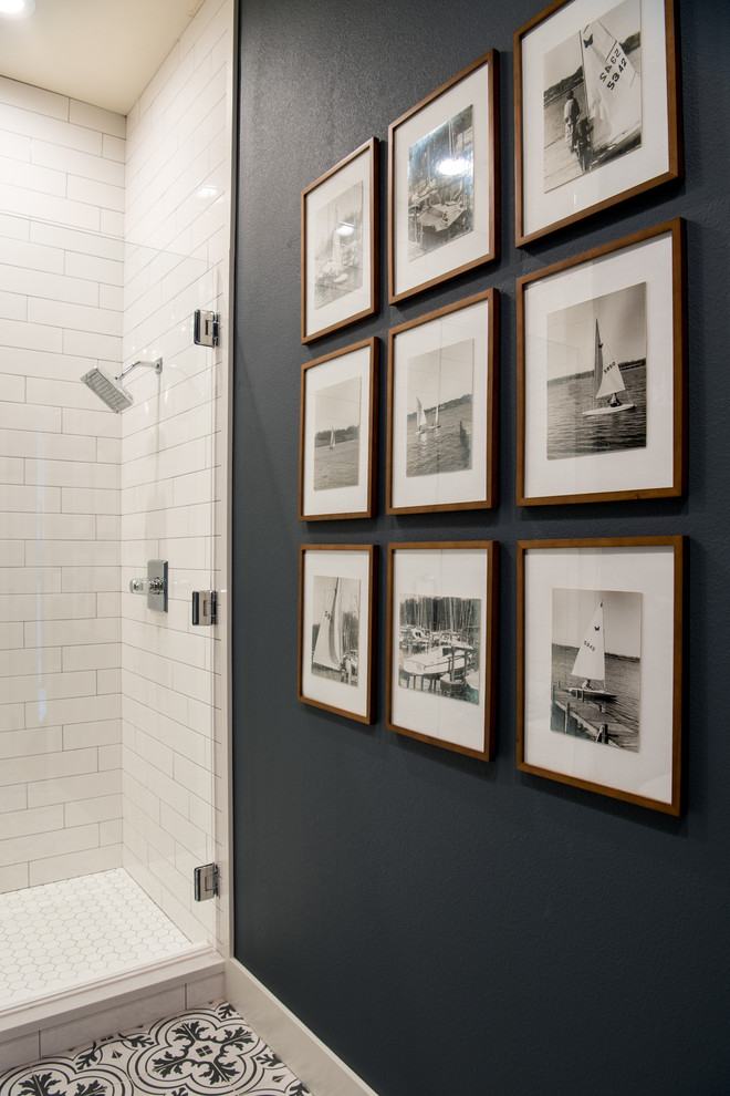 Alcove shower - small coastal 3/4 white tile and ceramic tile cement tile floor and multicolored floor alcove shower idea with shaker cabinets, medium tone wood cabinets, a two-piece toilet, black walls, an undermount sink, quartz countertops and a hinged shower door