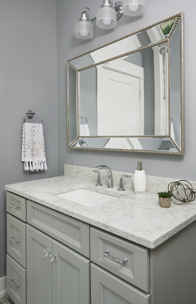 Inspiration for a traditional bathroom in Grand Rapids with recessed-panel cabinets, white cabinets, grey walls, a submerged sink, granite worktops, white worktops, a single sink and a freestanding vanity unit.