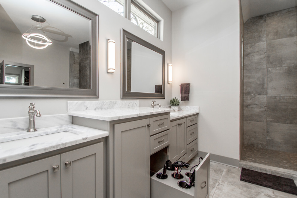 Bathroom - large contemporary master gray tile concrete floor and gray floor bathroom idea in Little Rock with shaker cabinets, gray cabinets, gray walls, an undermount sink, marble countertops and gray countertops