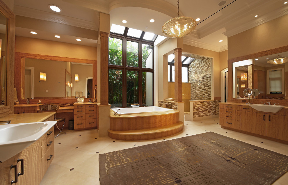 Design ideas for a classic ensuite bathroom in Miami with flat-panel cabinets, medium wood cabinets, a built-in bath, a built-in shower, multi-coloured tiles, matchstick tiles, beige walls, a built-in sink, beige floors, an open shower and beige worktops.