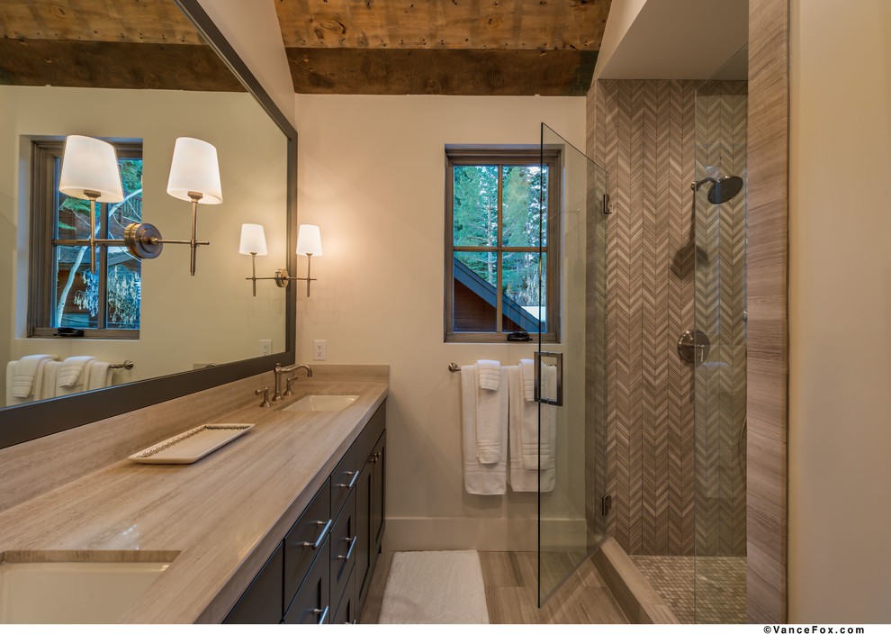 This is an example of a medium sized rustic shower room bathroom in Sacramento with shaker cabinets, brown cabinets, a corner shower, grey walls, dark hardwood flooring, a submerged sink, grey floors and a hinged door.