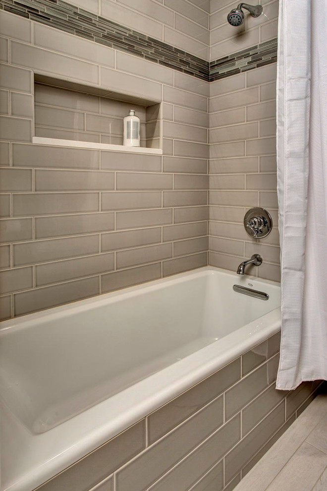 Example of a large trendy master gray tile porcelain tile alcove shower design in Seattle with dark wood cabinets, a two-piece toilet, beige walls and an undermount sink