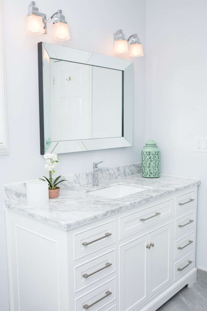 Small classic ensuite bathroom in Toronto with white cabinets, marble worktops, an alcove shower, blue tiles, mosaic tiles, blue walls, porcelain flooring and recessed-panel cabinets.